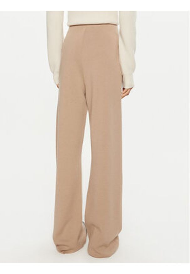 Calvin Klein Spodnie dresowe K20K207680 Beżowy Relaxed Fit. Kolor: beżowy. Materiał: wełna