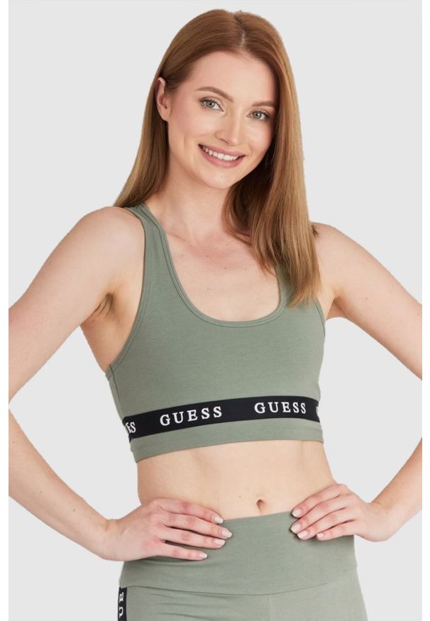 Guess - GUESS Zielony top sportowy damski z logo, Rozmiar L. Kolor: zielony. Materiał: bawełna. Styl: sportowy