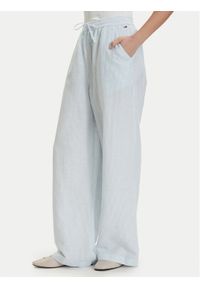 Tommy Jeans Spodnie materiałowe DW0DW22285 Niebieski jasny Loose Fit. Kolor: niebieski. Materiał: len #1
