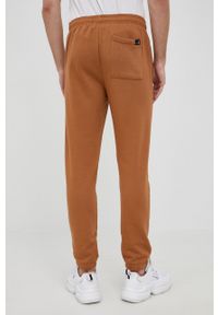 GAP spodnie x Disney męskie kolor brązowy z nadrukiem. Kolor: brązowy. Wzór: nadruk, motyw z bajki #4