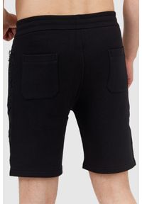 Balmain - BALMAIN Bawełniane szorty męskie z wypukłym logo. Kolor: czarny. Materiał: poliester #5
