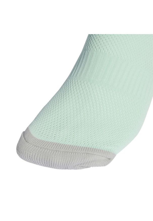 Getry piłkarskie Adidas Milano 23. Kolor: zielony. Materiał: poliester, elastan. Sport: piłka nożna