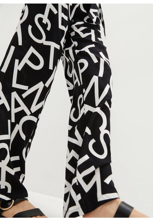 bonprix - Spodnie Marlena z wiązanym paskiem. Kolor: czarny. Wzór: nadruk