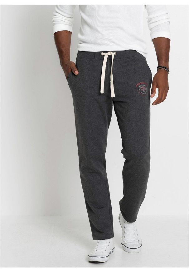 bonprix - Spodnie sportowe z czystej bawełny, ze sportowymi detalami. Kolor: szary. Materiał: bawełna. Wzór: nadruk. Styl: sportowy