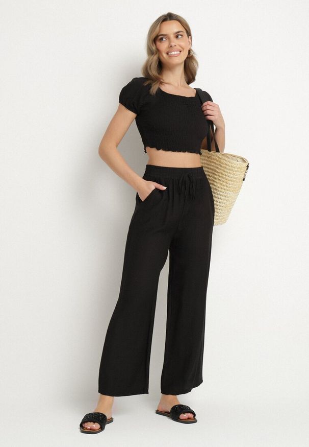 Born2be - Czarne Szerokie Spodnie Palazzo z Wysokim Stanem i Wiązaniem Myrlevia. Okazja: na co dzień. Stan: podwyższony. Kolor: czarny. Styl: casual, elegancki, klasyczny