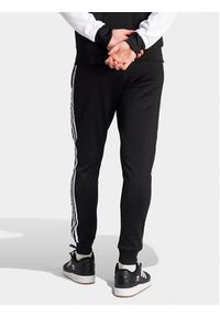 Adidas - adidas Spodnie dresowe adicolor Classics SST IL2488 Czarny Slim Fit. Kolor: czarny. Materiał: bawełna #3