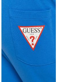 Guess - Spodnie. Kolor: niebieski. Materiał: dzianina. Wzór: gładki #3