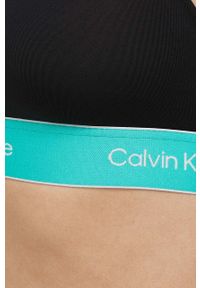 Calvin Klein Performance biustonosz sportowy Pride kolor czarny. Kolor: czarny. Rodzaj stanika: wyciągane miseczki. Sport: fitness, taniec #2