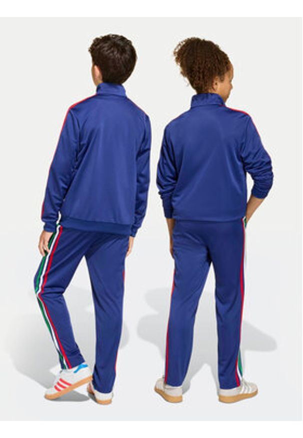 Adidas - adidas Spodnie dresowe Firebird KC9503 Niebieski Regular Fit. Kolor: niebieski. Materiał: syntetyk