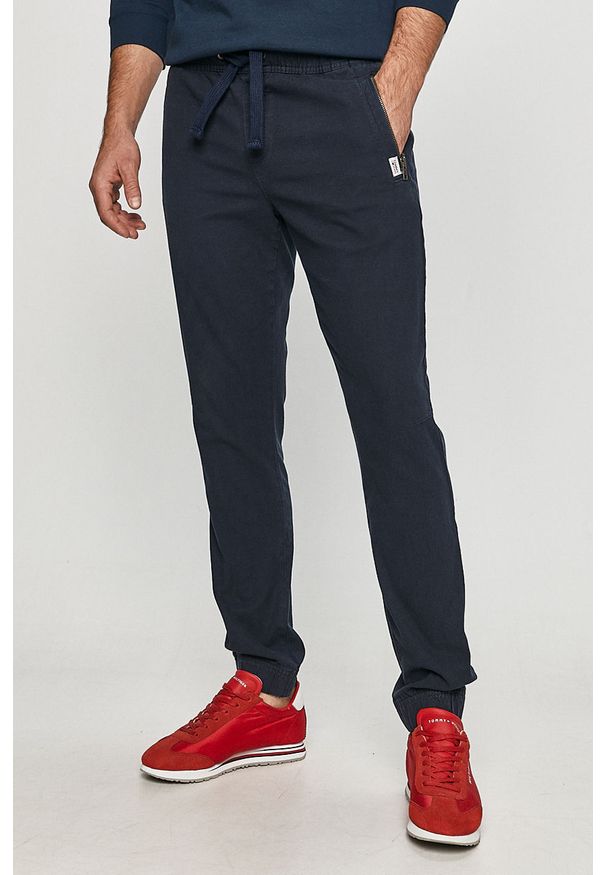 Tommy Jeans - Spodnie. Kolor: niebieski. Materiał: tkanina, bawełna, elastan. Wzór: gładki