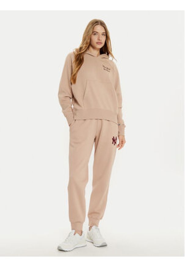 Champion Spodnie dresowe 117510 Beżowy Regular Fit. Kolor: beżowy. Materiał: bawełna