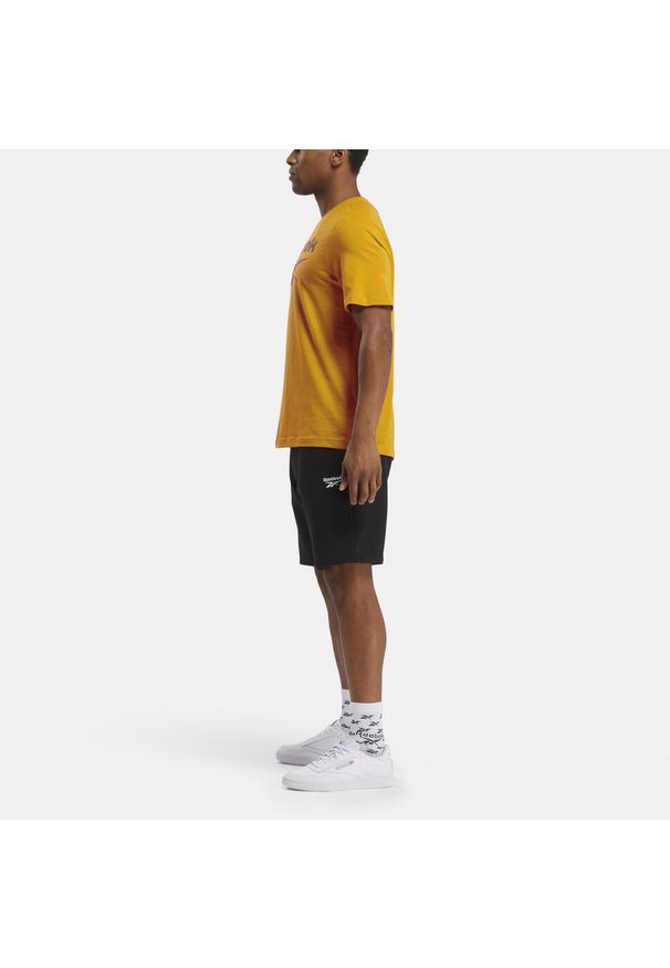Koszulka fitness męska Reebok krótki rękaw. Kolor: żółty. Materiał: bawełna. Długość rękawa: krótki rękaw. Długość: krótkie. Sport: fitness