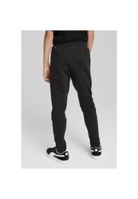 Puma - Młodzieżowe spodnie Evostripe PUMA Black. Kolor: czarny