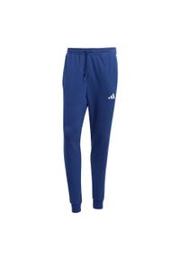 Adidas - Spodnie Essential 3-Stripes French Terry. Kolor: biały, wielokolorowy, niebieski. Materiał: materiał