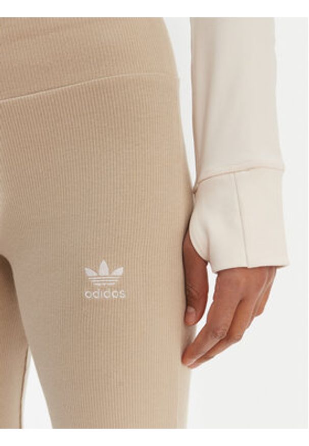 Adidas - adidas Legginsy Essentials KD3850 Beżowy Flared Leg. Kolor: beżowy. Materiał: wiskoza