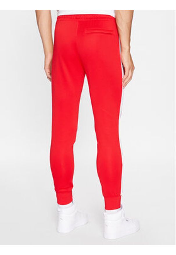 Puma Spodnie dresowe Iconic T7 530098 Czerwony Regular Fit. Kolor: czerwony. Materiał: bawełna, syntetyk