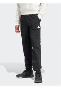 Adidas - adidas Spodnie dresowe Graphic Print IP4073 Czarny Regular Fit. Kolor: czarny. Materiał: bawełna. Wzór: nadruk