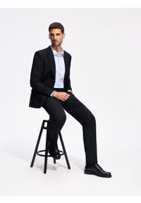 Reserved - Spodnie garniturowe slim fit - granatowy. Kolor: niebieski. Materiał: tkanina, wiskoza #1