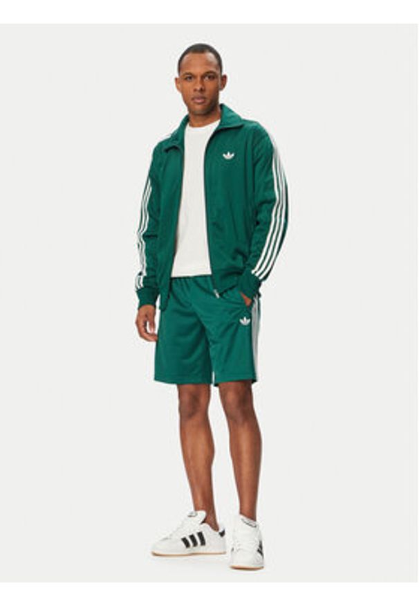 Adidas - adidas Bluza Firebird KD8314 Zielony Loose Fit. Kolor: zielony. Materiał: syntetyk