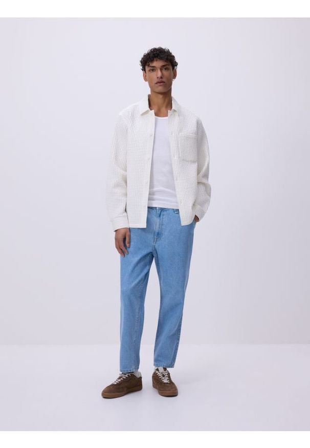 Reserved - Jeansy carrot fit - niebieski. Kolor: niebieski