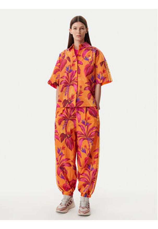 Adidas - adidas Spodnie dresowe FARM Premium JD6301 Pomarańczowy Loose Fit. Kolor: pomarańczowy. Materiał: syntetyk