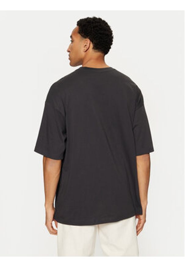 Champion T-Shirt 220279 Czarny Relaxed Fit. Kolor: czarny. Materiał: bawełna