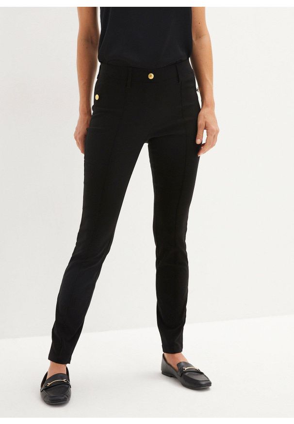 bonprix - Spodnie ze stretchem, gumką w talii i ozdobnymi guzikami. Kolor: czarny