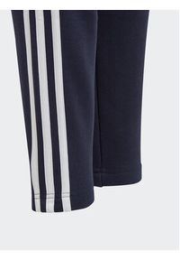Adidas - adidas Spodnie dresowe Essentials 3-Stripes IC6128 Granatowy Slim Fit. Kolor: niebieski. Materiał: bawełna