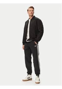 Adidas - adidas Spodnie dresowe Firebird Woven KE1371 Czarny Regular Fit. Kolor: czarny. Materiał: syntetyk #2