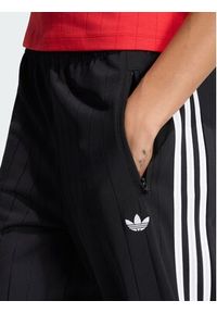 Adidas - adidas Spodnie dresowe Pinstripe Firebird KS6787 Czarny Loose Fit. Kolor: czarny. Materiał: syntetyk #3