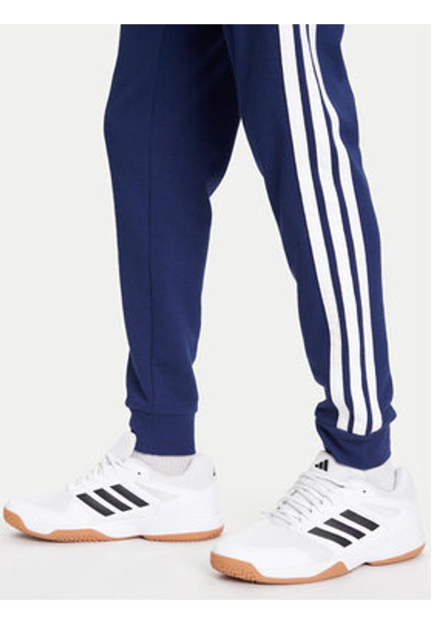 Adidas - adidas Spodnie dresowe Essential 3-Stripes JD1878 Niebieski Regular Fit. Kolor: niebieski. Materiał: syntetyk