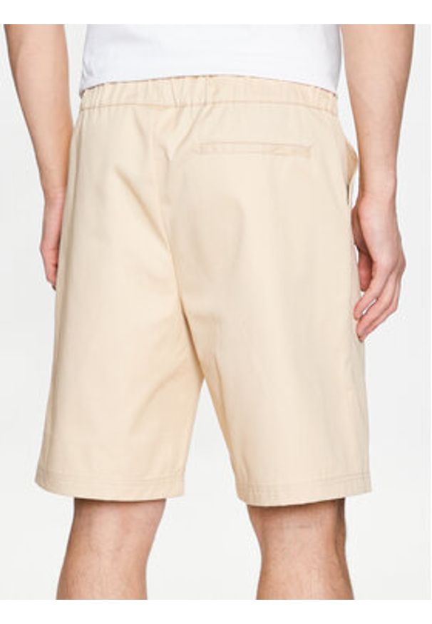 Champion Szorty materiałowe 217239 Beżowy Relaxed Fit. Kolor: beżowy. Materiał: bawełna