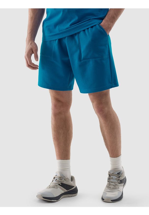 4f - 4F Spodenki dresowe męskie - niebieskie M. Kolor: niebieski. Materiał: dresówka. Długość: krótkie. Wzór: gładki, nadruk, ze splotem