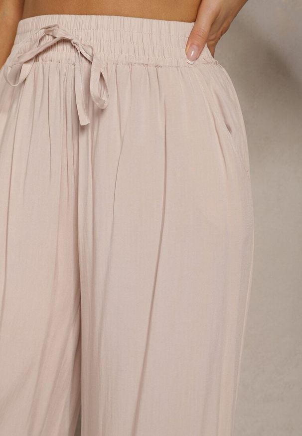 Renee - Beżowe Bawełniane Szerokie Spodnie Kuloty High Waist z Gumką w Talii Evitaes. Okazja: na co dzień, na spotkanie biznesowe. Stan: podwyższony. Kolor: beżowy. Materiał: bawełna. Styl: biznesowy, elegancki, casual