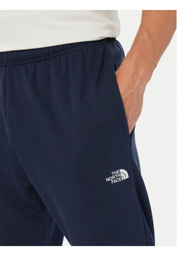 The North Face Spodnie dresowe Evolution Simple Dome NF0A8CWY Granatowy Regular Fit. Kolor: niebieski. Materiał: syntetyk