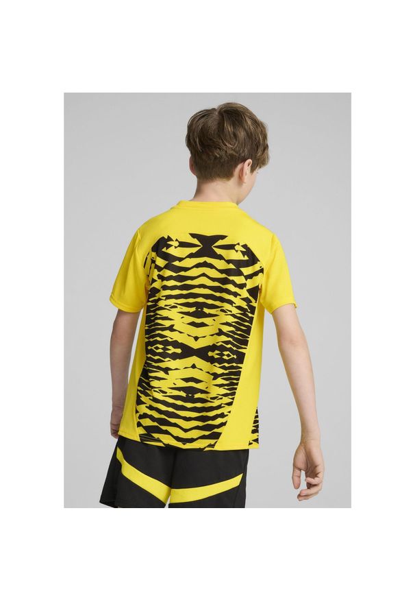 Puma - Młodzieżowa koszulka przedmeczowa z krótkim rękawem Borussia Dortmund PUMA. Kolor: żółty, wielokolorowy, czarny. Długość rękawa: krótki rękaw. Długość: krótkie