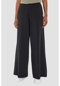 Guess - GUESS Czarne damskie spodnie dresowe Olympe Wide Leg, Rozmiar S. Kolor: czarny. Materiał: dresówka #1