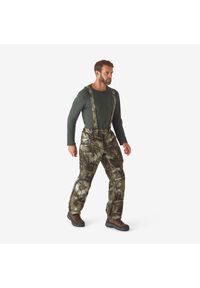 SOLOGNAC - Spodnie z szelkami Solognac 900 Warm wodoodporne camo treemetic. Kolor: zielony, brązowy, wielokolorowy. Materiał: tkanina, skóra. Sport: outdoor