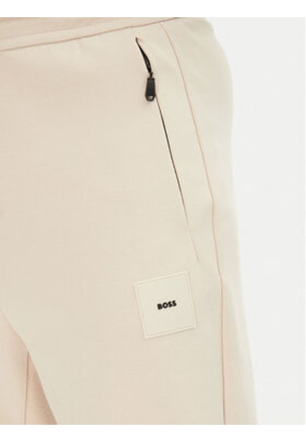 BOSS Spodnie dresowe Hadiko 50537198 Beżowy Regular Fit. Kolor: beżowy. Materiał: bawełna