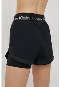 Calvin Klein Performance szorty treningowe damskie kolor czarny z nadrukiem high waist. Stan: podwyższony. Kolor: czarny. Materiał: dzianina, tkanina. Wzór: nadruk