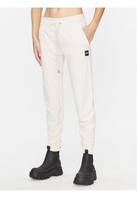 Spodnie dresowe DKNY Sport. Kolor: beżowy. Materiał: dresówka #1