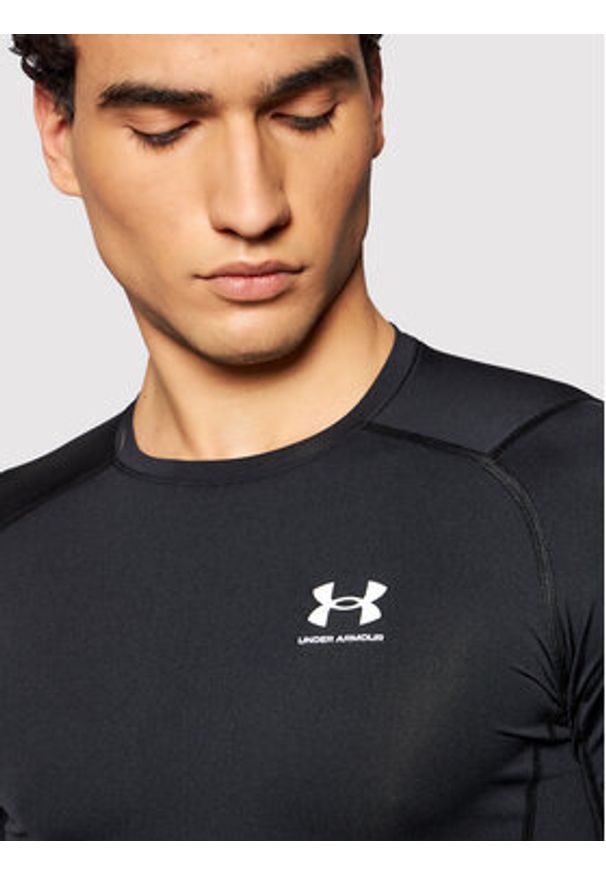 Under Armour Koszulka techniczna Ua HeatGear 1361518 Czarny Slim Fit. Kolor: czarny. Materiał: syntetyk