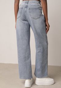 Born2be - Niebieskie Bawełniane Szerokie Jeansy z Wysokim Stanem Wycięciami i Perełkami Felatia. Okazja: na co dzień, na imprezę. Stan: podwyższony. Kolor: niebieski. Styl: casual, klasyczny #6