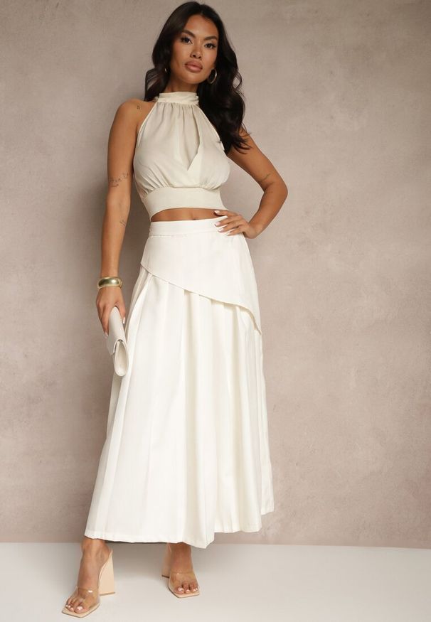 Renee - Beżowa Asymetryczna Spódnica Plisowana z Bawełną i Wiskozą Natunelia. Okazja: na co dzień, na spotkanie biznesowe. Kolor: beżowy. Materiał: bawełna, wiskoza. Styl: biznesowy, casual, elegancki