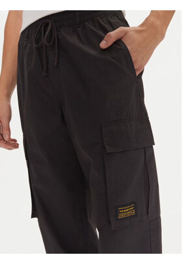 Champion Spodnie dresowe 220415 Czarny Loose Fit. Kolor: czarny. Materiał: bawełna