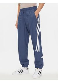 Adidas - adidas Spodnie dresowe Future Icons 3-Stripes IR9239 Niebieski Slim Fit. Kolor: niebieski. Materiał: syntetyk #1