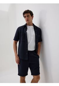 Reserved - Szorty regular fit - granatowy. Kolor: niebieski. Materiał: dzianina, bawełna