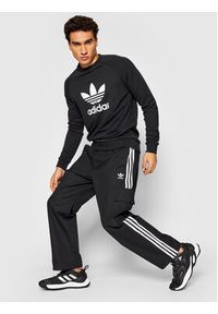Adidas - adidas Spodnie dresowe adicolor Classics 3-Stripes H09117 Czarny Relaxed Fit. Kolor: czarny. Materiał: bawełna, dresówka #2