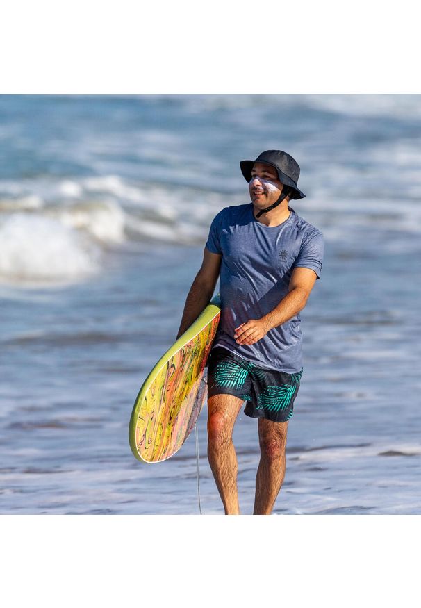 OLAIAN - Spodenki surfingowe męskie Olaian 100 Palm 15". Kolor: niebieski. Materiał: materiał, poliester. Długość: krótkie