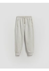 Reserved - Bawełniane joggery - beżowy. Kolor: beżowy. Materiał: bawełna